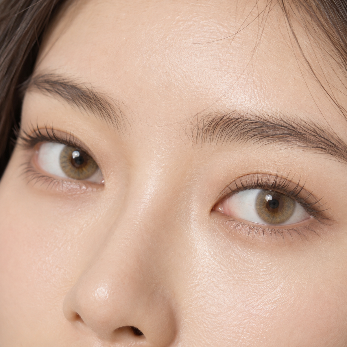 Oatmilk Hazel Silk Blend colored contacts - a softer creamy-hazel change on dark eyes built from the proven Tearlight Brown color family