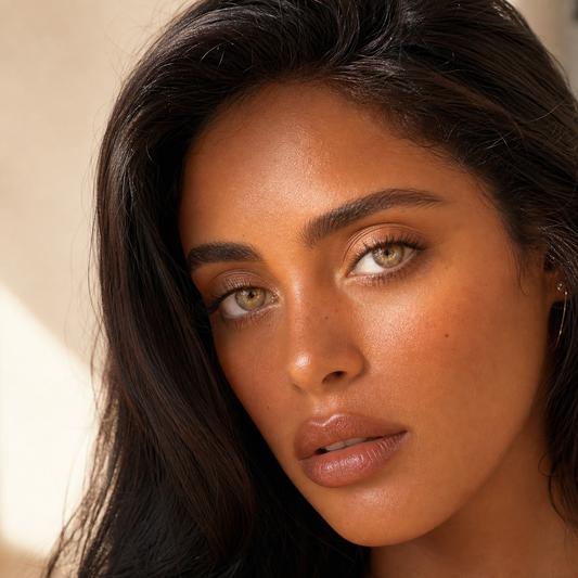 Honeyglass Gold colored contacts on model - sunlit window portrait