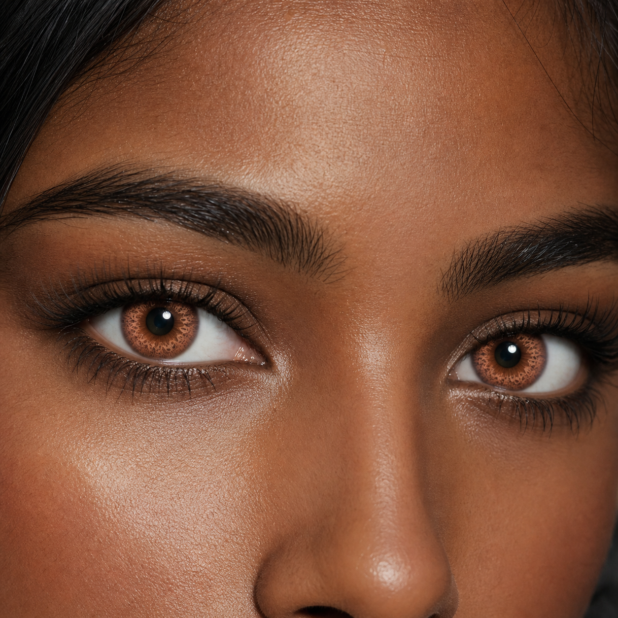 Coral Ember Bloom colored contacts - a vivid but wearable coral shift that stays legible on darker eyes
