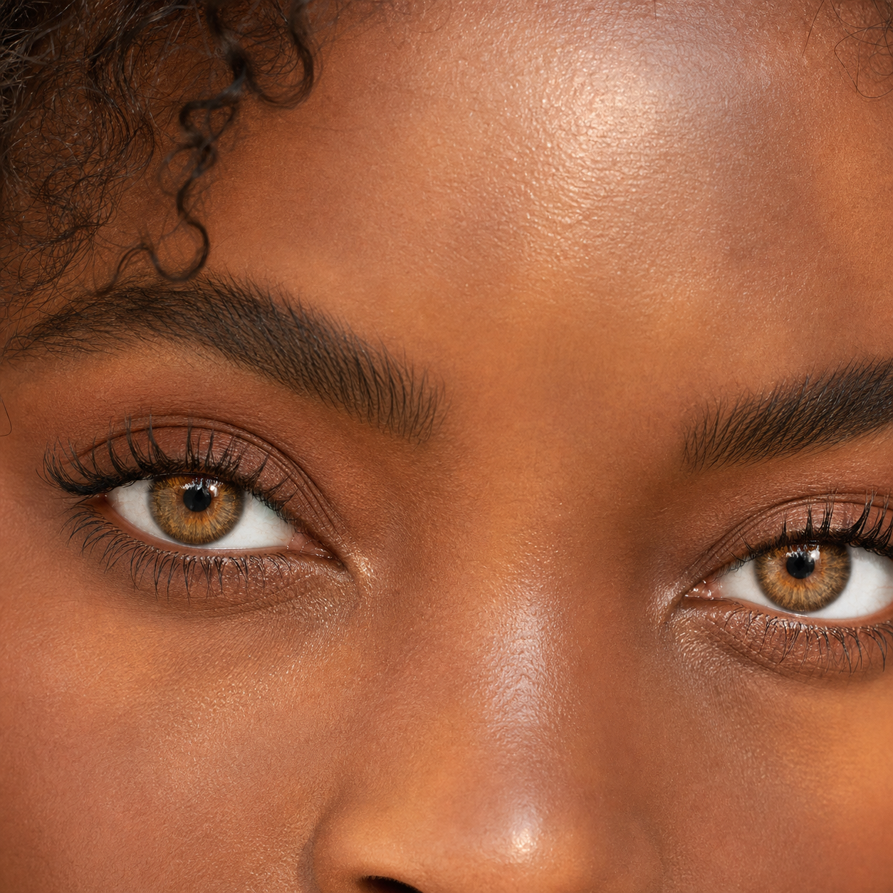 Amber Velvet Hazel colored contacts - warm honey-hazel payoff shown in daylight and on dark eyes